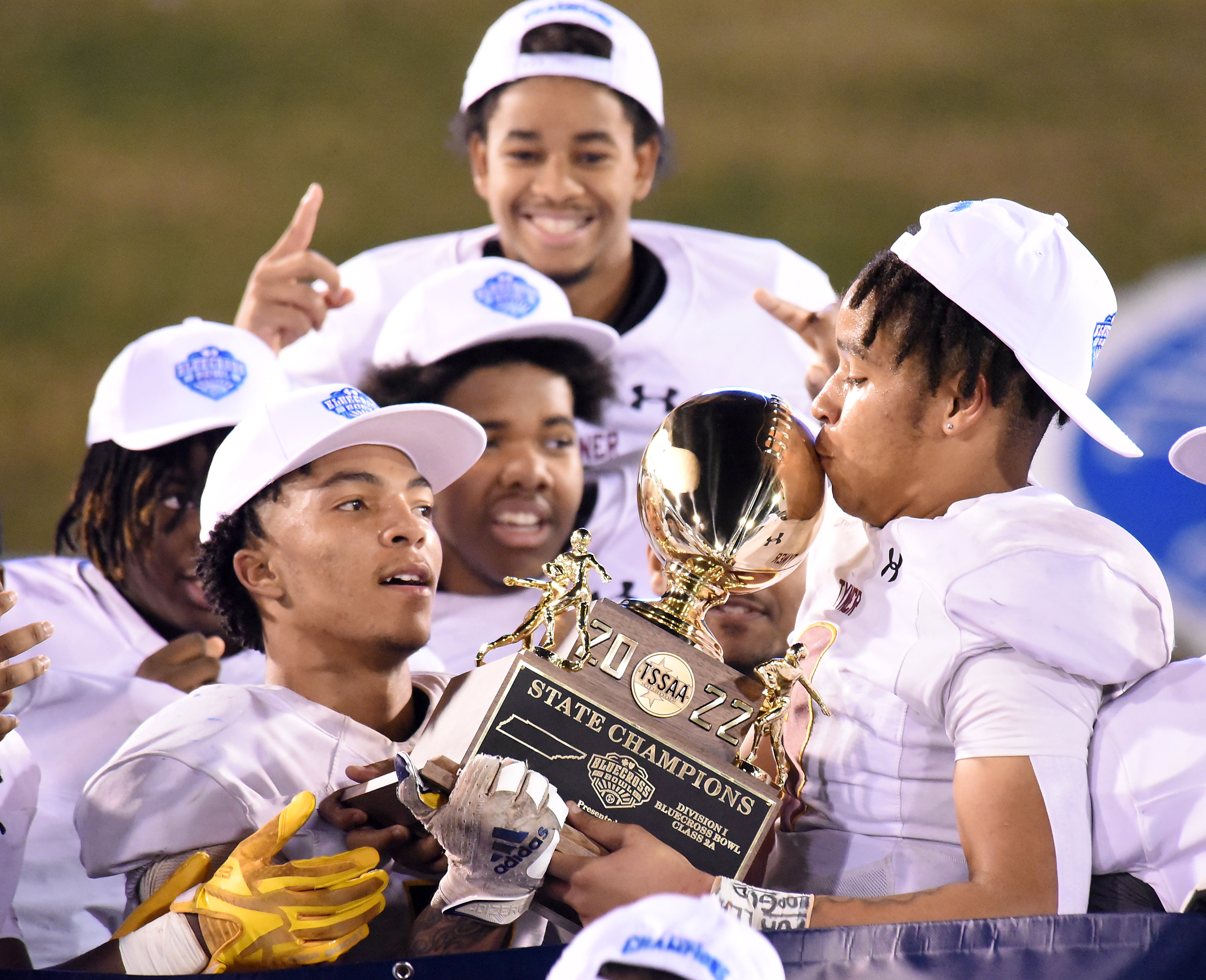Staff Photo by Matt Hamilton / Tyner (9) Joshua Jackson kisses the trophy after winning the Class 2A BlueCross Bowl state championship game at Finley Stadium on Saturday, December 3, 2022.