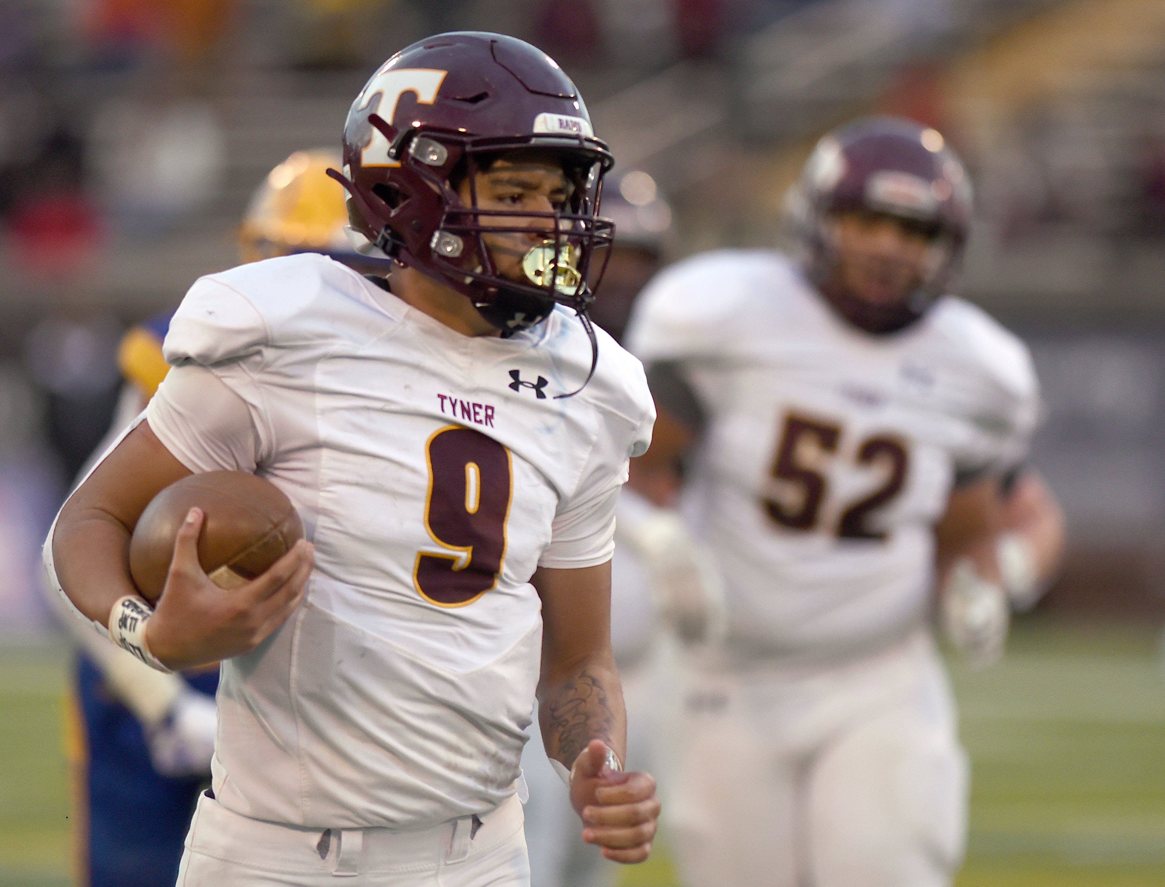 Staff Photo by Matt Hamilton / Tyner (9) Joshua Jackson scrambles out of the pocket for positive yards during the Class 2A BlueCross Bowl state championship game at Finley Stadium on Saturday, December 3, 2022.
