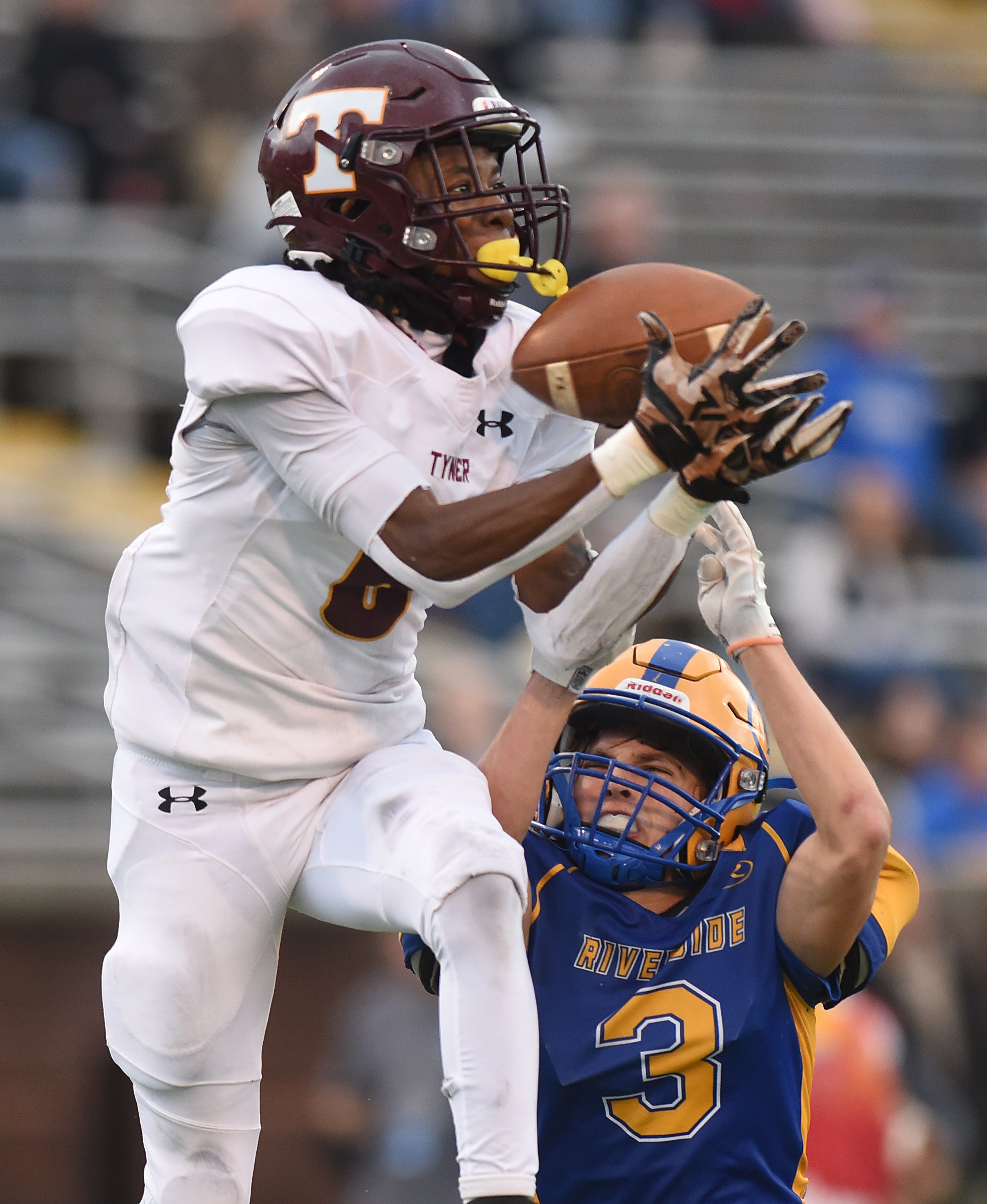 Staff Photo by Matt Hamilton / Tyner (6) Marcus Lewis catches a 22-yard touchdown pass over Riverside (3) Keeton Evans during the Class 2A BlueCross Bowl state championship game at Finley Stadium on Saturday, December 3, 2022.