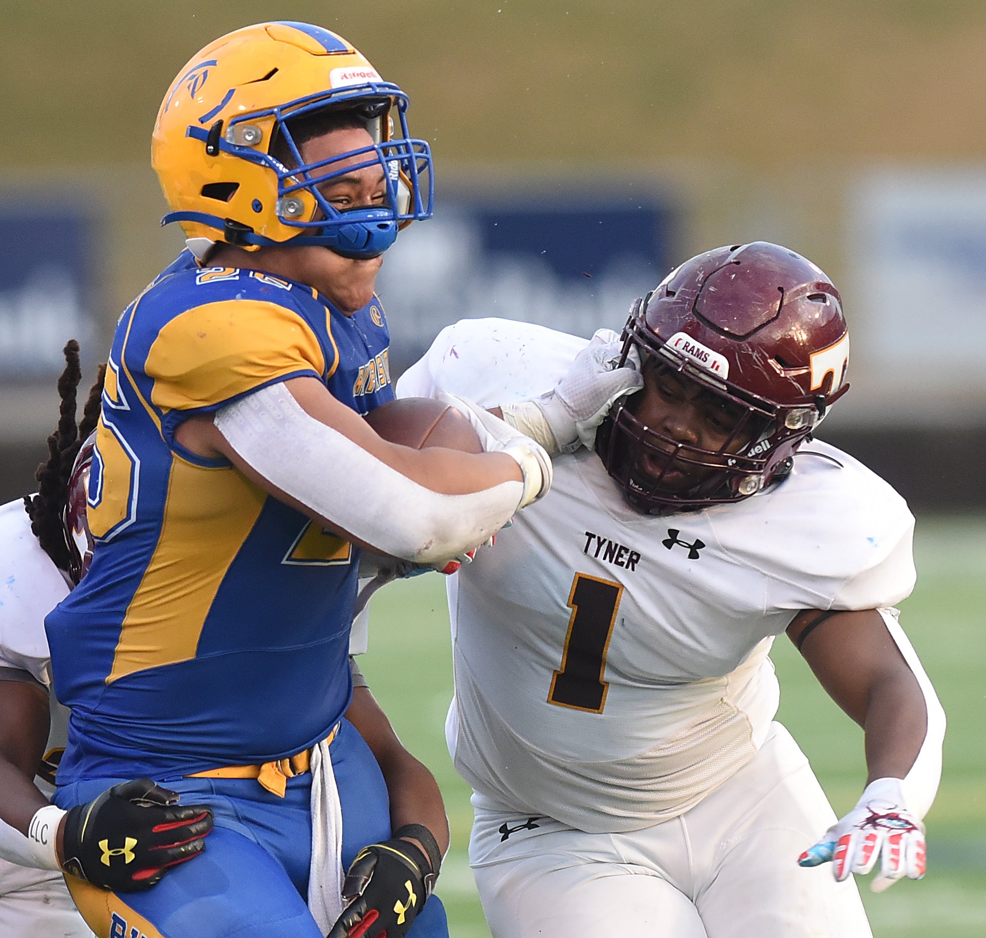 Staff Photo by Matt Hamilton / Tyner (1) Jersey Chubb hits Riverside (25) Desmond Thomas, nearly knocking his helmet off, during the Class 2A BlueCross Bowl state championship game at Finley Stadium on Saturday, December 3, 2022.