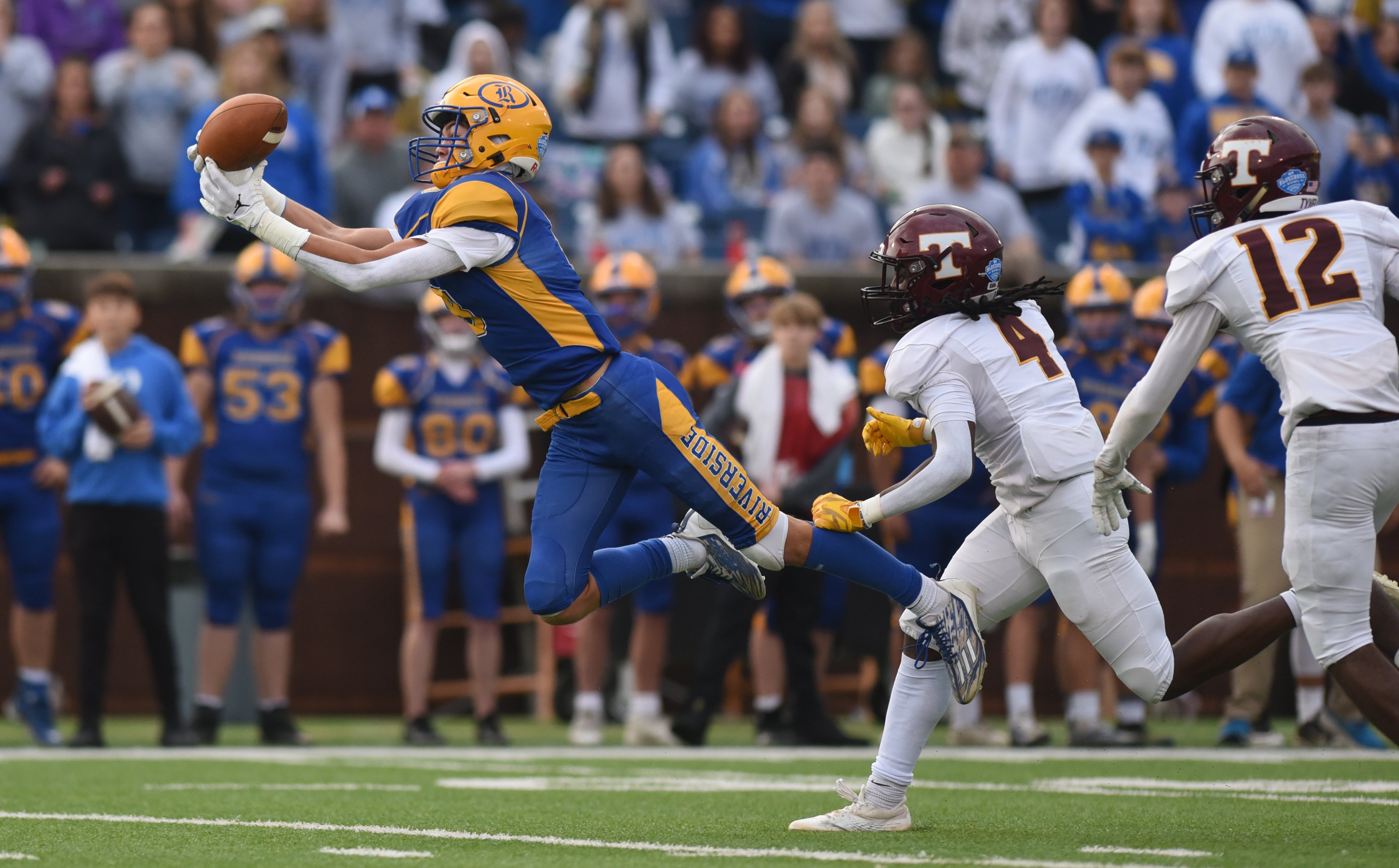 Staff Photo by Matt Hamilton / Riverside (8) William Wallace catches a pass over the middle during the Class 2A BlueCross Bowl state championship game at Finley Stadium on Saturday, December 3, 2022.