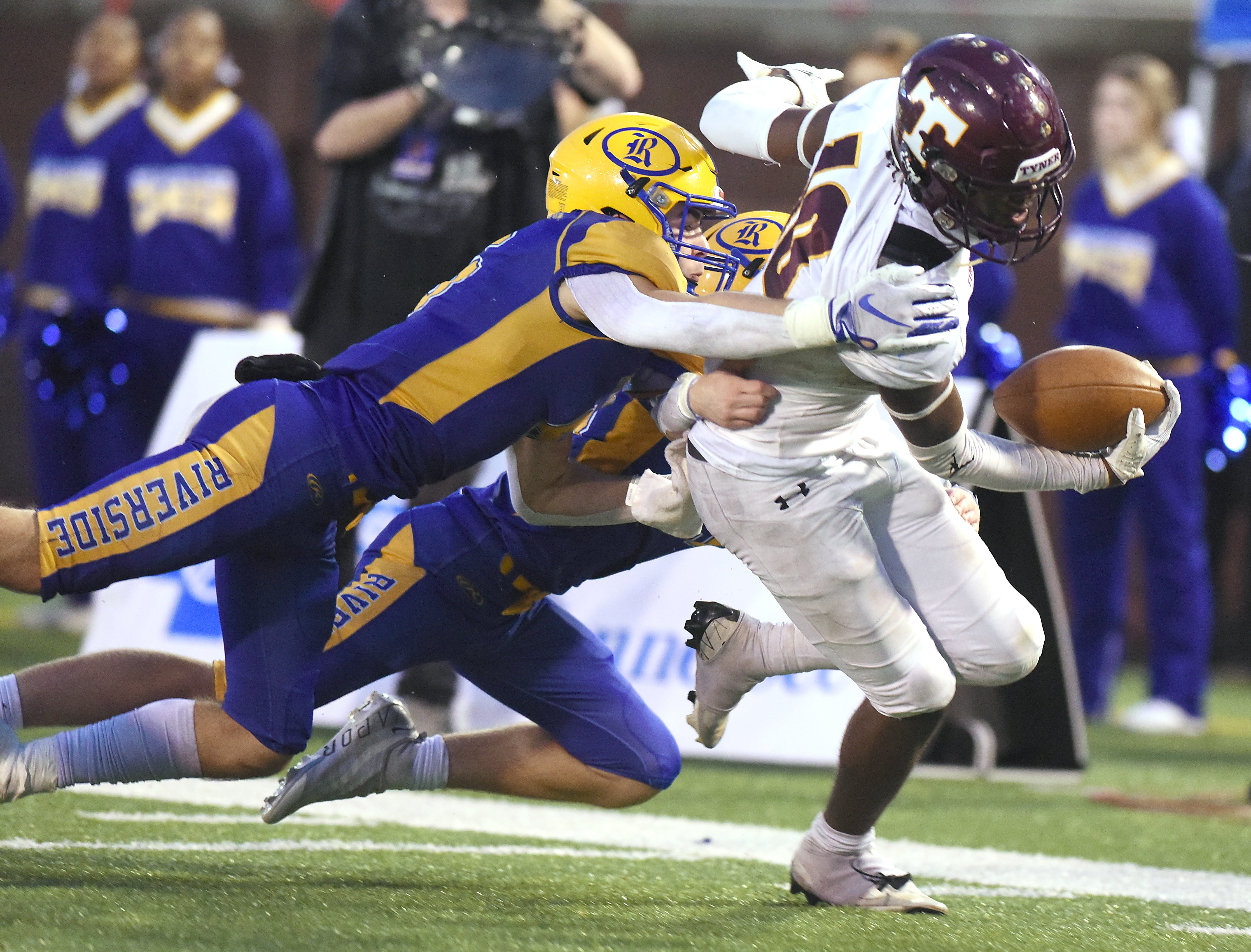 Staff Photo by Matt Hamilton / Tyner (10) McKinley Markel drags defenders on his way to a touchdown during the Class 2A BlueCross Bowl state championship game at Finley Stadium on Saturday, December 3, 2022.