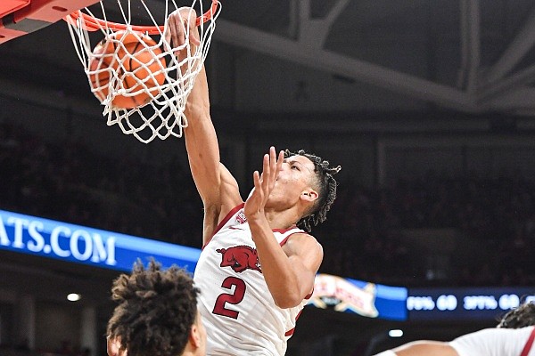 Arkansas forward Trevon Brazile (2) dunks, Saturday, Dec. 3, 2022, during the second half of the Razorbacks’ 99-58 win over the San Jose State Spartans at Bud Walton Arena in Fayetteville. Visit nwaonline.com/photo for the photo gallery.