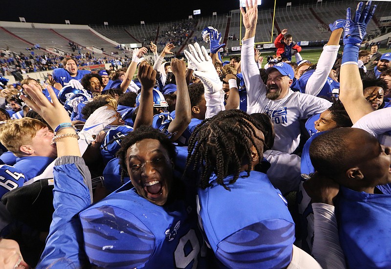 Bryant head coach Buck James celebrates with his players after the Hornets' 36-7 win in the Class 7A state championship game on Friday, Dec. 2, 2022, at War Memorial Stadium in Little Rock. .More photos at www.arkansasonline.com/123state7a/.(Arkansas Democrat-Gazette/Thomas Metthe)