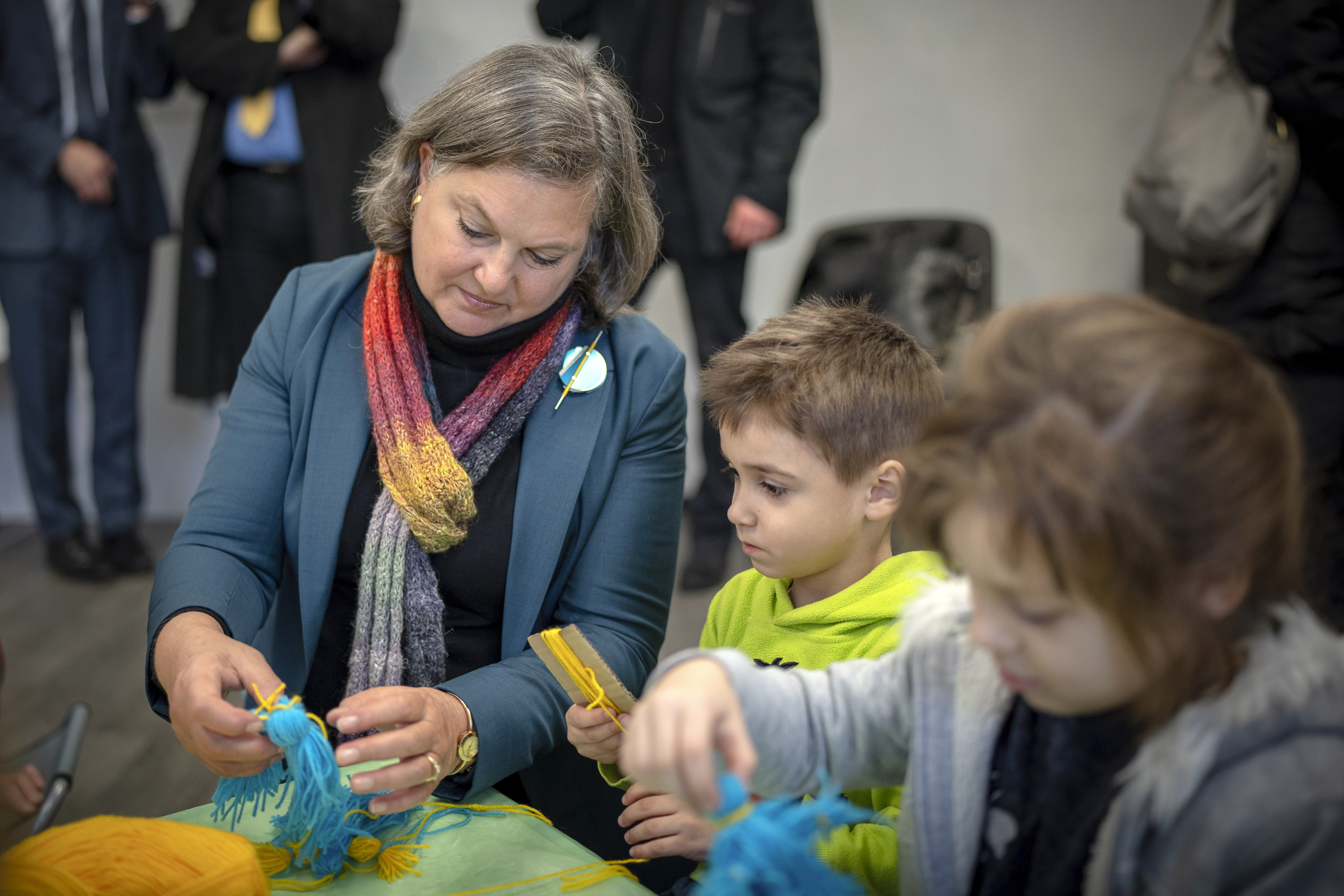Under Secretary of State for Political Affairs Victoria Nuland, plays with children who have been driven from their homes in the country's eastern and southern regions because of the war, in Kyiv, Ukraine, Saturday, Dec. 3, 2022. (AP Photo/Roman Gritsyna)