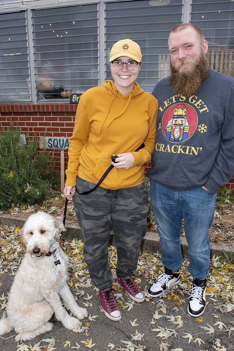 Buckthorn with owners Maddie and Zachary Tanner on 11/27/2022 at St. Joseph Center's Merry Market.