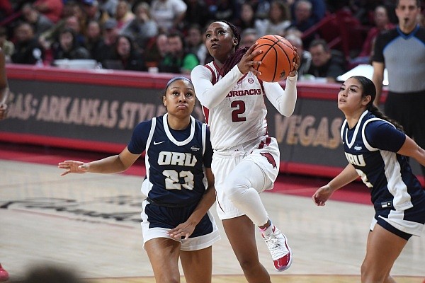 Arkansas' Samara Spencer drives to the rim and readies for a layup during the Razorbacks' game against Oral Roberts on Dec. 4, 2022, in Bud Walton Arena.