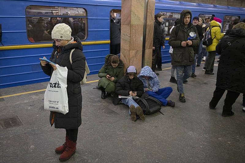 People rest in the subway station being used as a bomb shelter during a rocket attack in Kyiv, Ukraine, Monday, Dec. 5, 2022. Ukraineâ€™s air force said it shot down more than 60 of about 70 missiles that Russia fired on in its latest barrage against Ukraine. It was the latest onslaught as part of Moscowâ€™s new, stepped-up campaign that has largely targeted Ukrainian infrastructure and disrupted supplies of power, water and heat in the country as winter looms. (AP Photo/Andrew Kravchenko)