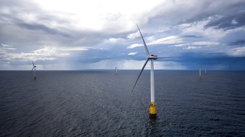 Hywind Scotland, the world's first commercial wind farm using floating wind turbines, is visible off the coast of Scotland in August 2017. Tuesday, Dec. 6, 2022, marks the first-ever U.S. auction for leases to develop commercial-scale floating wind farms in the deep waters off the West Coast.  (Woldcam/Equinor via AP)