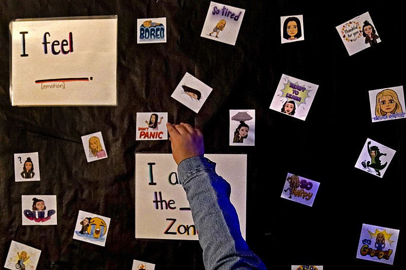 FILE - A student visits a sensory room at Williams Elementary School, on Nov. 3, 2021, in Topeka, Kan. Schools contending with soaring student mental health needs and other challenges have been struggling to determine just how much the pandemic is to blame. (AP Photo/Charlie Riedel)