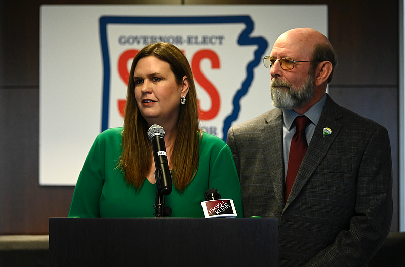 Governor Elect Sarah Huckabee Sanders stands with Mike Mills as she announces her intention to nominate him as secretary of the department of Parks, Heritage, and Tourism during a press conference in Little Rock on Tuesday, Dec. 6, 2022. (Arkansas Democrat-Gazette/Stephen Swofford)