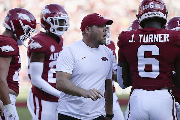 Arkansas defensive coordinator Barry Odom talks to players prior to a game against Missouri State on Saturday, Sept. 17, 2022, in Fayetteville.