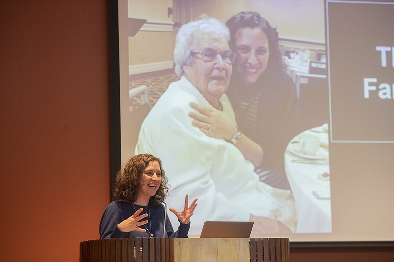 Courtney Doi speaks at the Fayetteville Public Library on Wednesday, sharing the story of her grandmother, Judith Klein, the youngest of six children, who left Berlin on the Kindertransport in December 1938 just after Kristallnacht. Klein’s father, grandmother, two aunts and two of her siblings died in concentration camps.
(NWA Democrat-Gazette/J.T. Wampler)