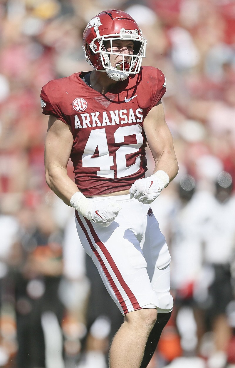 Arkansas linebacker Drew Sanders (42) celebrates a sack, Saturday, September 3, 2022 during the second quarter of a football game at Donald W. Reynolds Razorback Stadium in Fayetteville. Visit nwaonline.com/220904Daily/ for today's photo gallery...(NWA Democrat-Gazette/Charlie Kaijo)