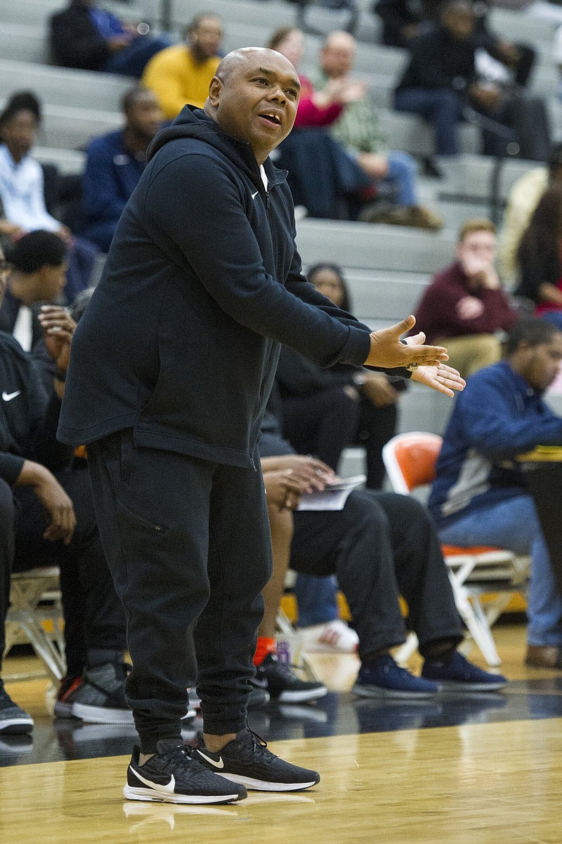 Hall High School head coach Jon Coleman reacts to a play call during the game against the Mills Comets at Cirks Arena in Little Rock on December 12, 2019. 
(Arkansas Democrat-Gazette/Jeff Gammons)