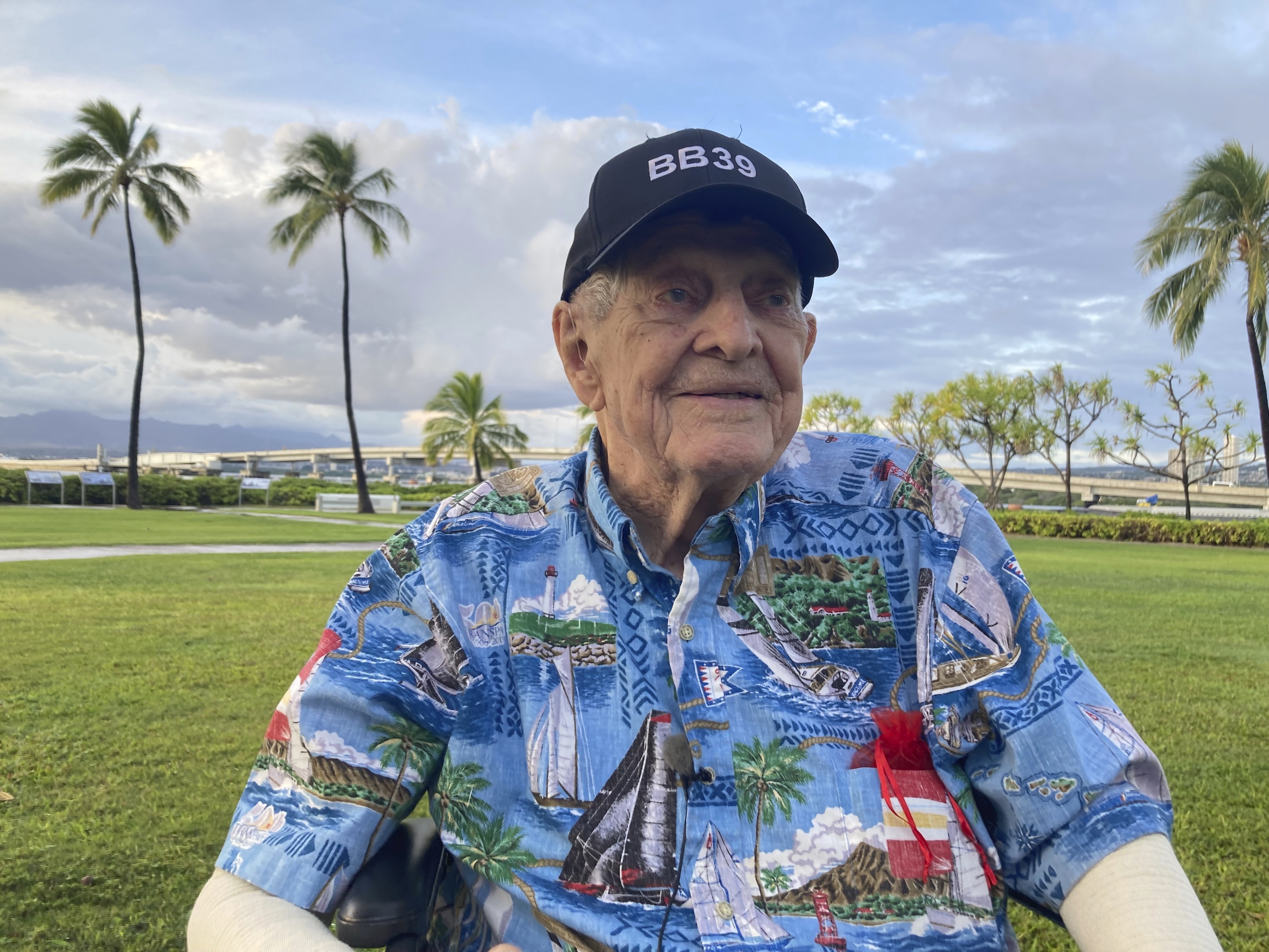 Robert John Lee, who witnessed the 1941 attack on Pearl Harbor as a 20-year-old civilian, sits in Pearl Harbor, Hawaii on Monday, Dec. 5, 2022. A handful of centenarian survivors of the attack on Pearl Harbor are expected to gather at the scene of the Japanese bombing on Wednesday, Dec. 7 to commemorate those who perished 81 years ago. (AP Photo/Audrey McAvoy)