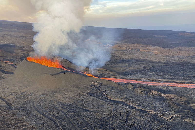 An erupting fissure on the Northeast Rift Zone of Mauna Loa is seen in this aerial image taken Wednesday. The volcano on the Big Island of Hawaii continued to erupt Thursday, but the lava flow was slowing, at least for now.
(AP/U.S. Geological Survey)