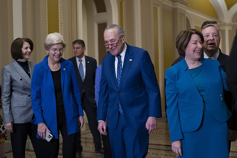 Senate Majority Leader Chuck Schumer (center), D-N.Y., is joined by his team following his win Thursday in the Senate Democratic Caucus leadership election at the U.S. Capitol.
(AP/J. Scott Applewhite)