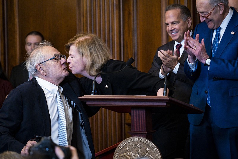 During Thursday’s signing ceremony for the Respect for Marriage Act, Sen. Tammy Baldwin, D-Wis., kisses former Rep. Barney Frank, the first sitting member of Congress to wed a same-sex partner.
(The New York Times/Pete Marovich)