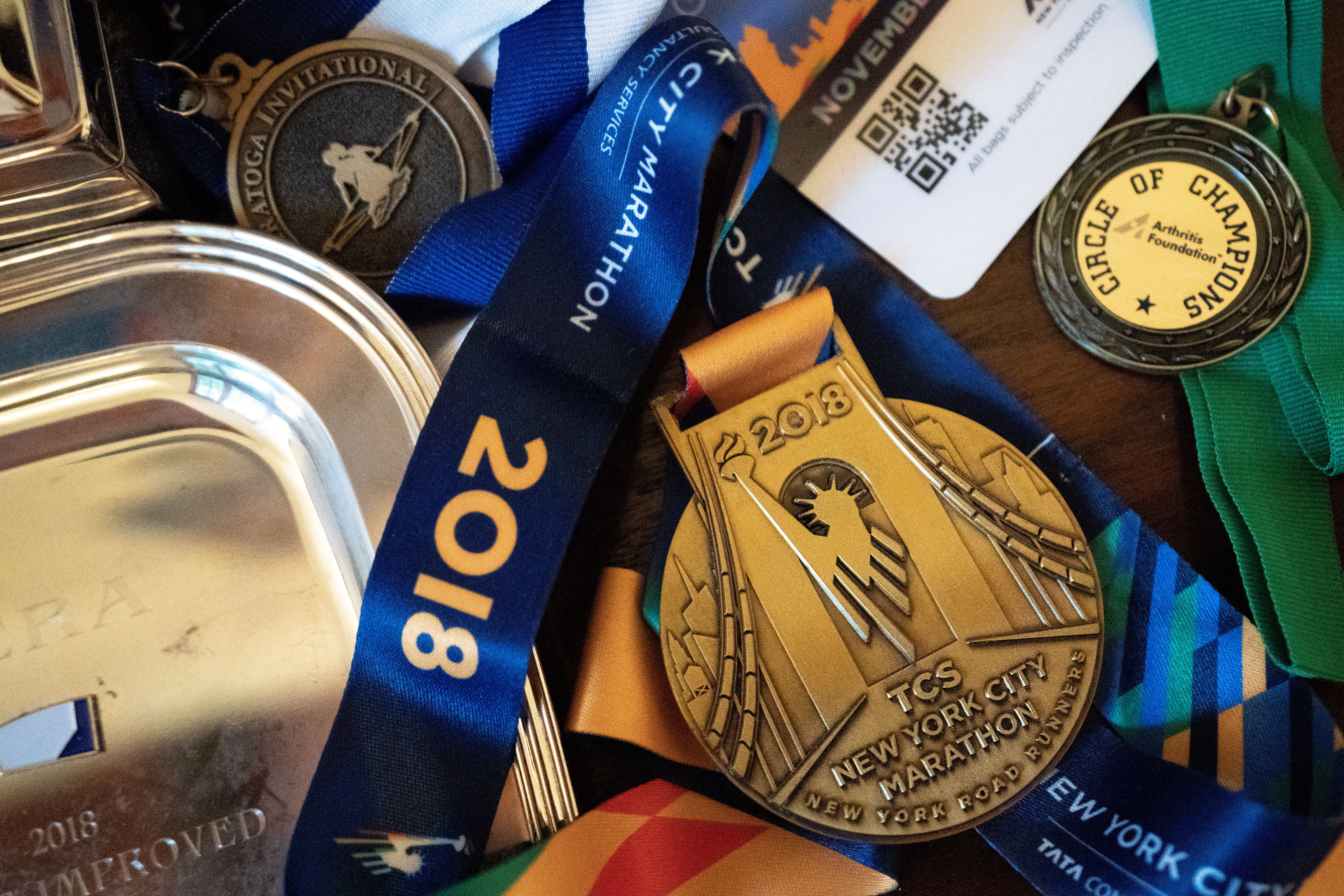 AP photo by Julia Nikhinson / Brian Lilly Jr.'s New York City Marathon medal is displayed on Oct. 13 in Brenda and Brian Lilly's home in Easton, Conn. Brian Lilly Jr., 19, who died of suicide on Jan. 4, 2021, was a rower at the University of California San Diego. The Lillys have filed a wrongful death lawsuit against UC San Diego and the rowing coach, Geoff Bond, who is no longer with the school.