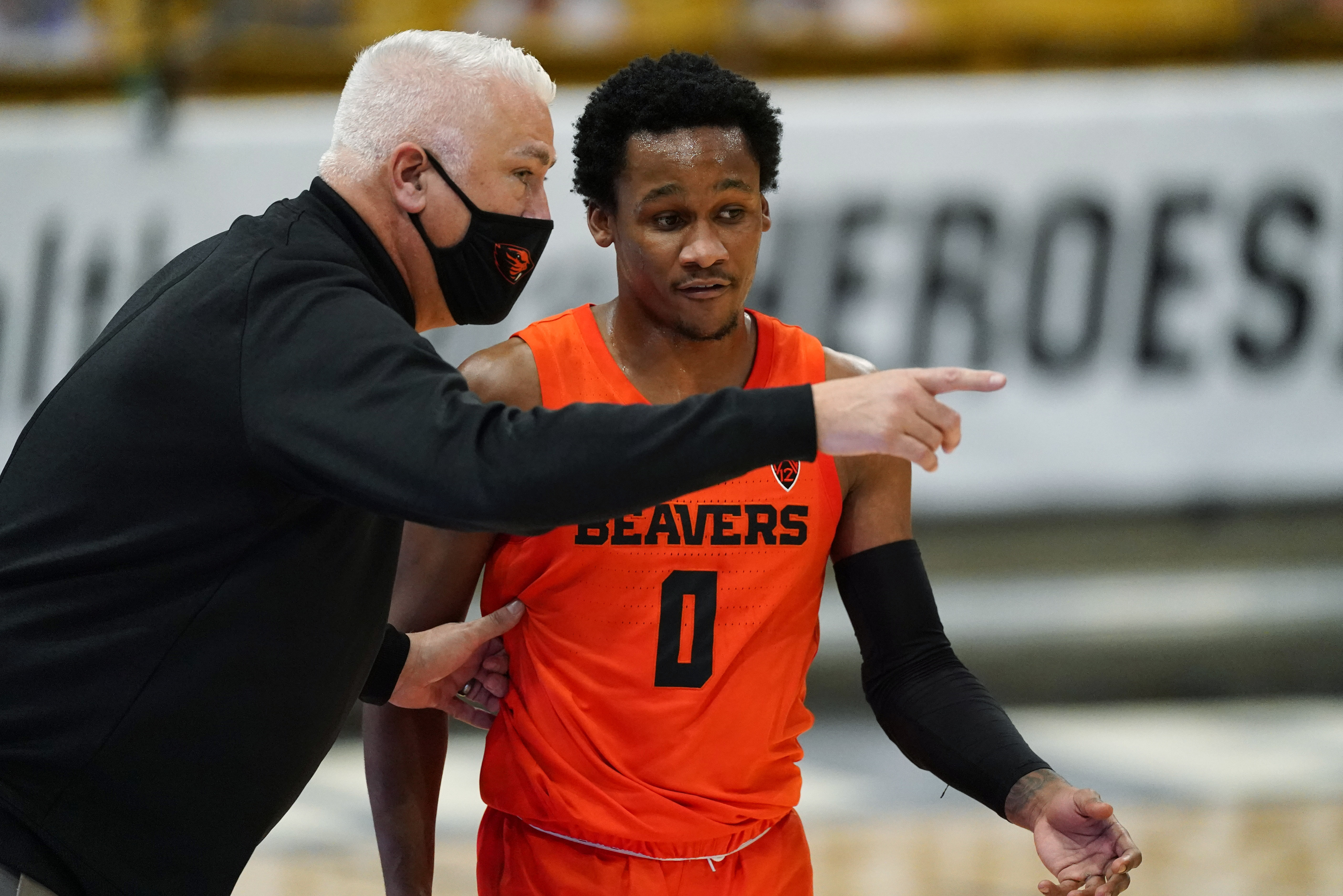 FILE - Oregon State head coach Wayne Tinkle, left, confers with guard Gianni Hunt in the first half of an NCAA college basketball game against Colorado on Feb. 8, 2021, in Boulder, Colo. Tinkle will be rooting for Gianni Hunt, a junior guard at Sacramento State who left Oregon State's program earlier this year. Hunt sought a fresh start after his playing time failed to develop as he had hoped. He took a leave of absence from the Beavers last season when his