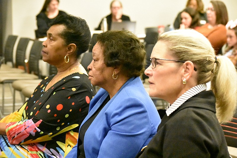 From left, former Pine Bluff School District educators Mattie Collins and Earlene Collins, and Pine Bluff lawyer Rosalind Mouser listen to a vote by the Arkansas Board of Education on installing a limited-authority board for the district during Thursday's regular meeting in Little Rock. (Pine Bluff Commercial/I.C. Murrell)