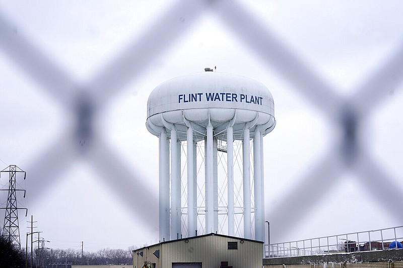 FILE - The Flint water plant tower is pictured on Jan. 6, 2022, in Flint, Mich. A judge dismissed criminal charges against former Michigan Gov. Rick Snyder in the Flint water crisis, months after the state Supreme Court said indictments returned by a one-person grand jury were invalid. (AP Photo/Carlos Osorio, File)