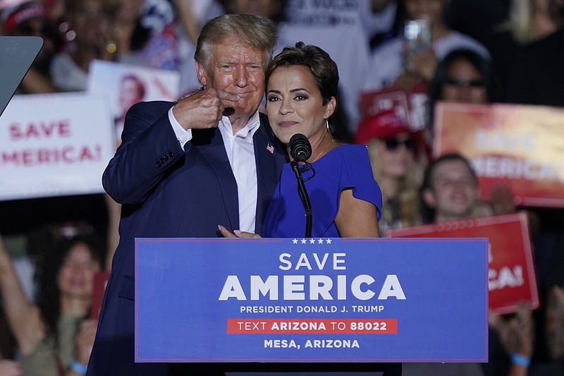 Former President Donald Trump embraces Arizona Republican gubernatorial candidate Kari Lake on Oct. 9 at a rally in Mesa, Ariz.
(AP/Matt York)