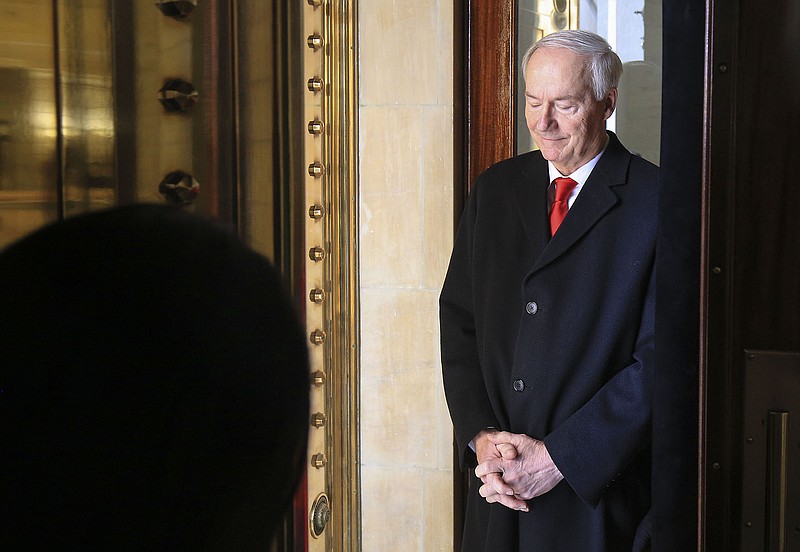 Taking a quiet moment, Gov. Asa Hutchinson waits inside the Capitol on Jan. 1, 2019, before walking out on the front steps to give his inaugural address after being sworn in for a second term. “What I think is important is where your leadership made a difference,” he said in an interview. “You look at things I’ve had to really get out there and lead on. That’s what I hope to be remembered for.”
(Arkansas Democrat-Gazette/Staton Breidenthal)