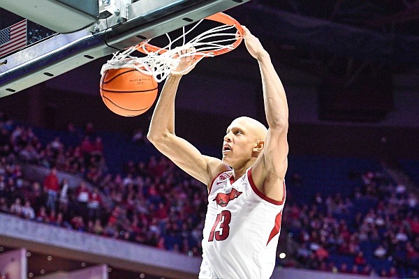 Arkansas guard/forward Jordan Walsh (13) dunks, Saturday, Dec. 10, 2022, during the second half of the Razorbacks’ 88-78 win over the Oklahoma Sooners at the BOK Center in Tulsa, Okla. Visit nwaonline.com/photo for the photo gallery.