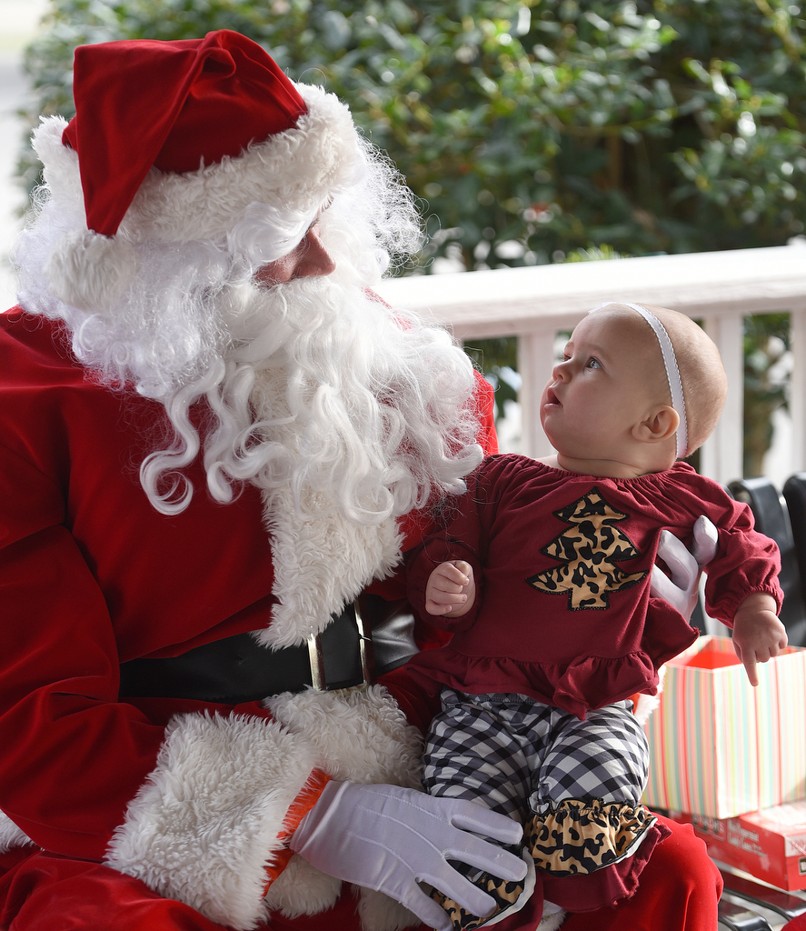 Staff photo by Matt Hamilton / Santa holds LaFayette resident Savana Wright, 6 mo., at Joe Stock Memorial Park in LaFayette, Ga. on Saturday, December 17, 2022. The cookies with Santa event was held as a fundraiser for Bridge Health, a community service board that offers adult programs, youth programs, programs for developmentally disabled and more.