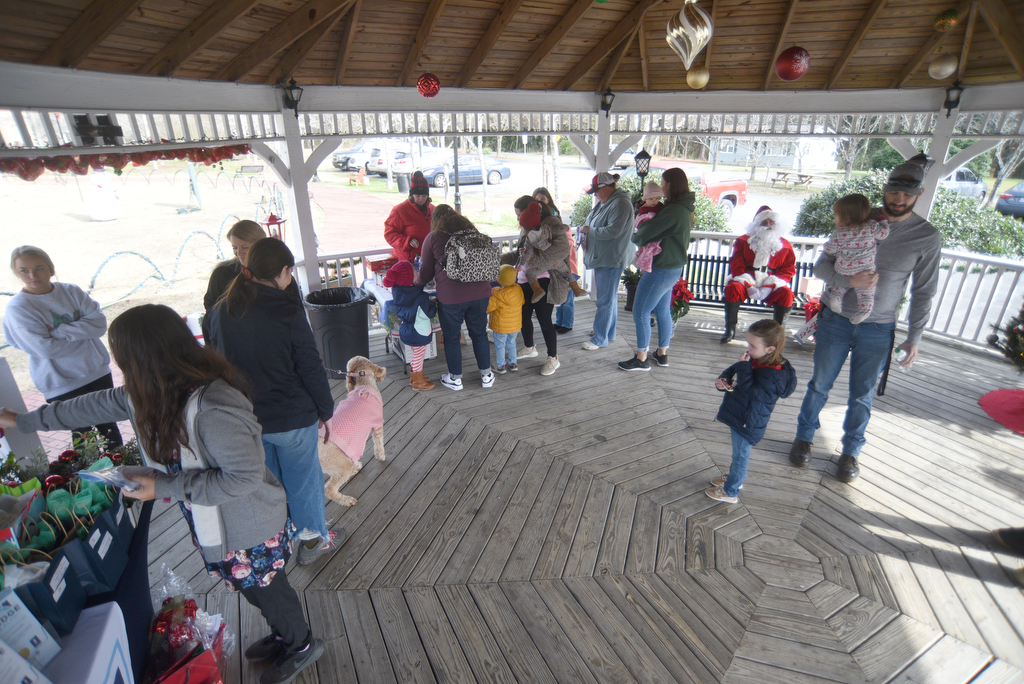 Staff photo by Matt Hamilton / Visitors receive gifts, write letters to Santa, decorate cookies and more at Joe Stock Memorial Park in LaFayette, Ga. on Saturday, December 17, 2022. The cookies with Santa event was held as a fundraiser for Bridge Health, a community service board that offers adult programs, youth programs, programs for developmentally disabled and more.