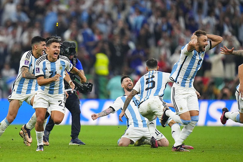 Argentinian players celebrate after winning penalty shootout during the World Cup final soccer match between Argentina and France at the Lusail Stadium in Lusail, Qatar, Sunday, Dec. 18, 2022. (AP/Petr David Josek)