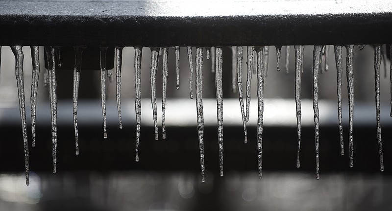 Staff Photo by Angela Lewis Foster/ The Chattanooga Times Free Press- 2/17/14. Icicles hang from a picnic table at the Pumpkin Patch on Signal Mountain.
