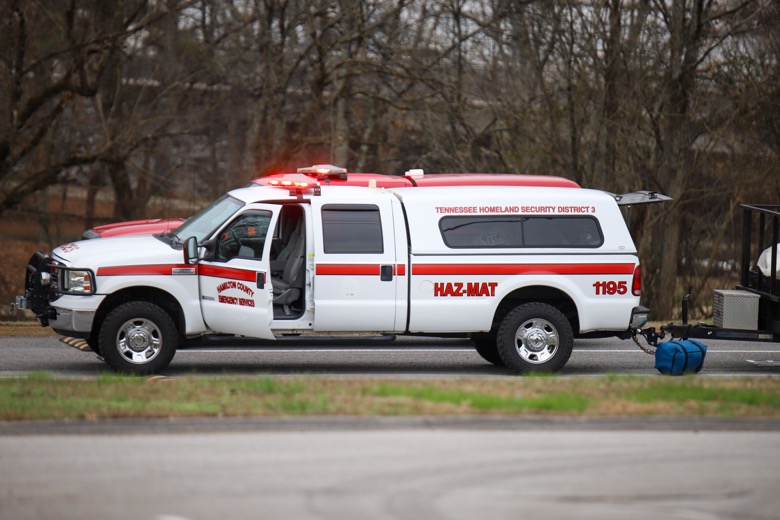Staff photo by Olivia Ross  / Emergency vehicles sit in the Ooltewah Middle School parking lot near the railroad tracks on Tuesday, December 20, 2022 following a train derailment in Collegedale.