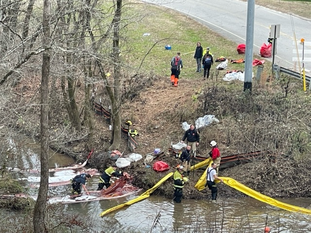 Authorities use absorbent booms and pads to assist with a large diesel spill for the three locomotives that were derailed in Collegedale, Tennessee, on Dec. 20, 2022. / Photo provided by Hamilton County Office of Emergency Management