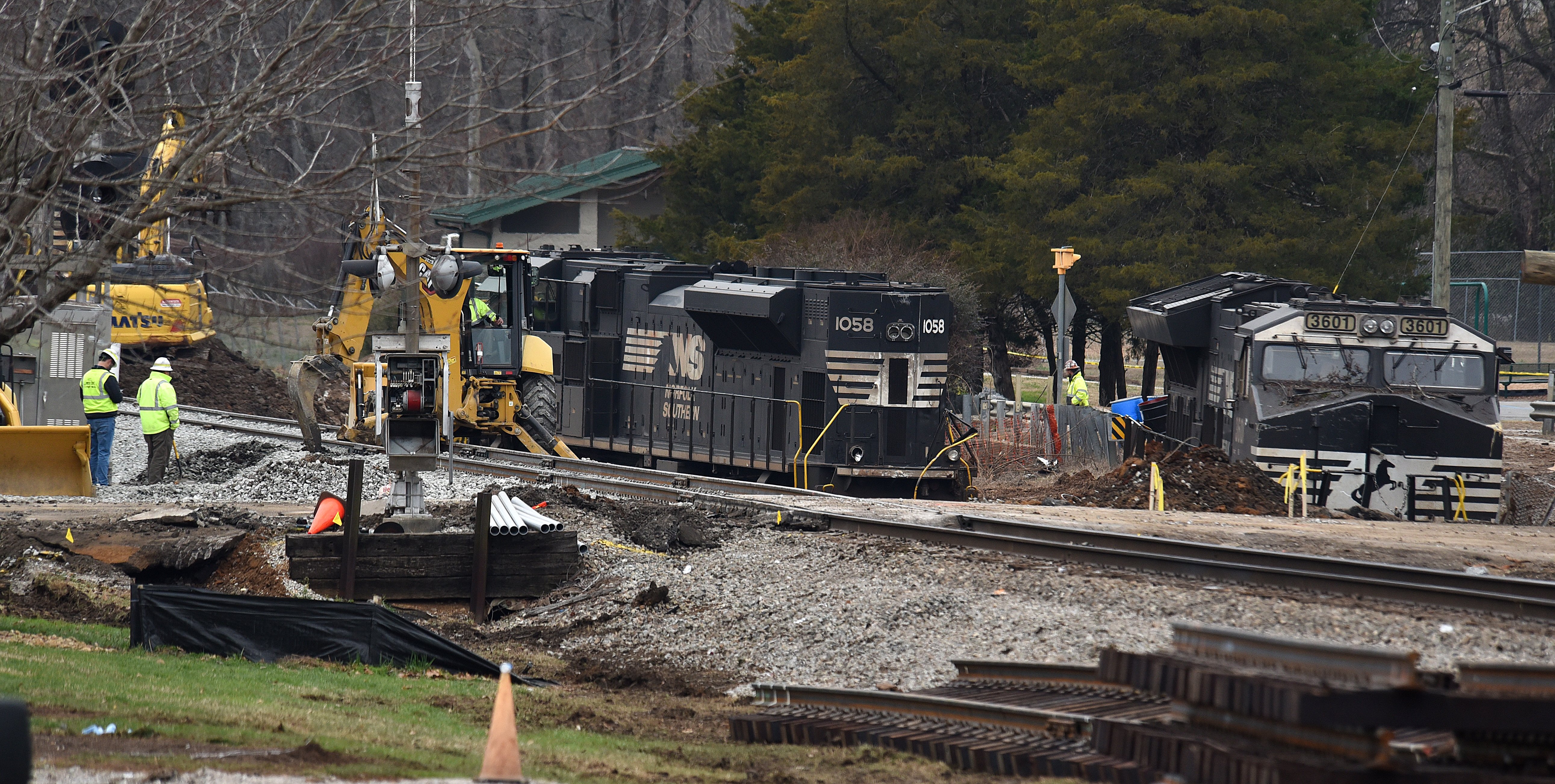 Staff photo by Matt Hamilton / Locomotives rest along the side of the tracks as workers repair the tracks at the site of the train derailment at the intersection of the tracks with Apison Pike on Wednesday, December 21, 2022.