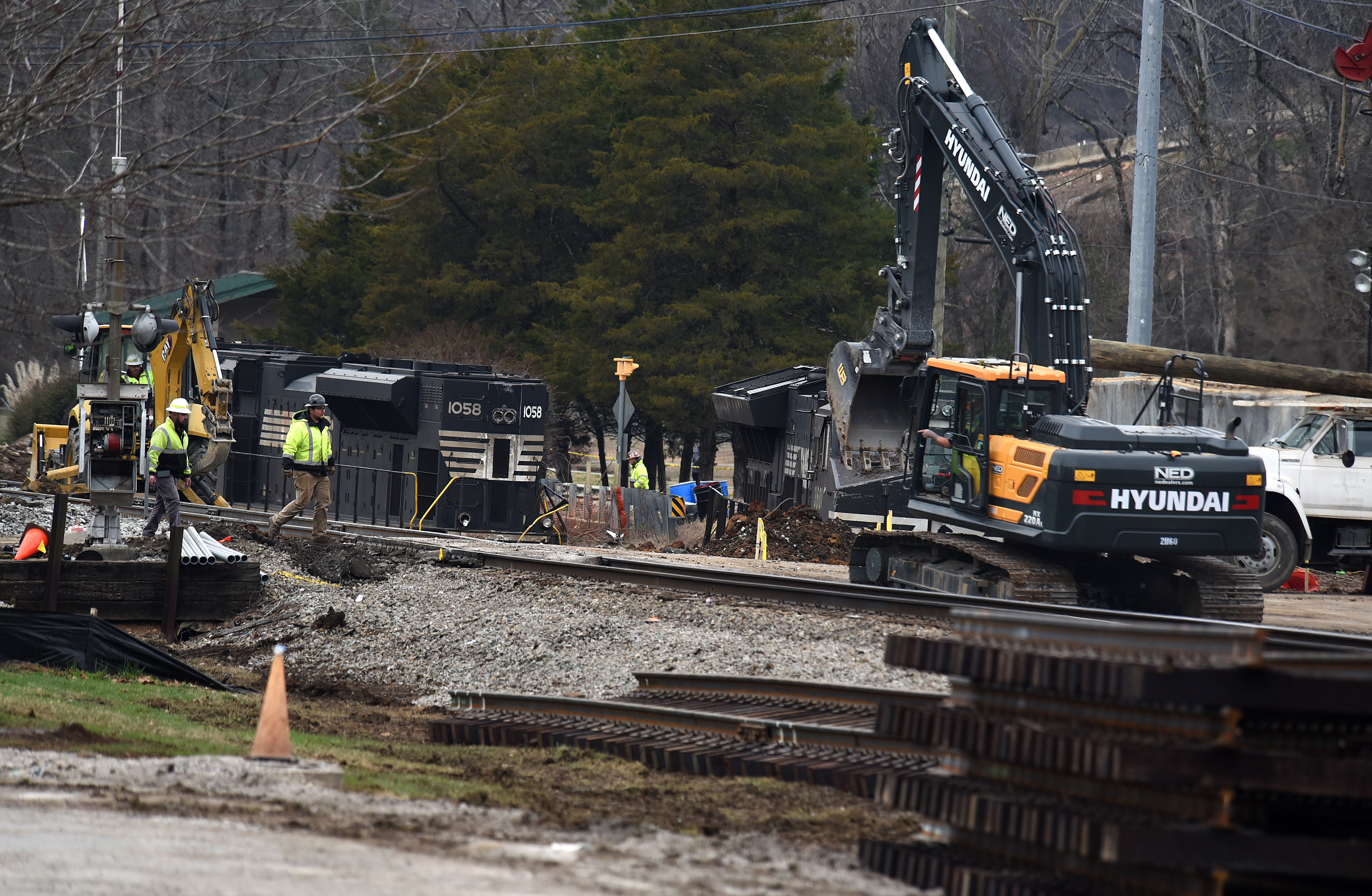 Staff photo by Matt Hamilton / Locomotives rest along the side of the tracks as workers repair the tracks at the site of the train derailment at the intersection of the tracks with Apison Pike on Wednesday, December 21, 2022.