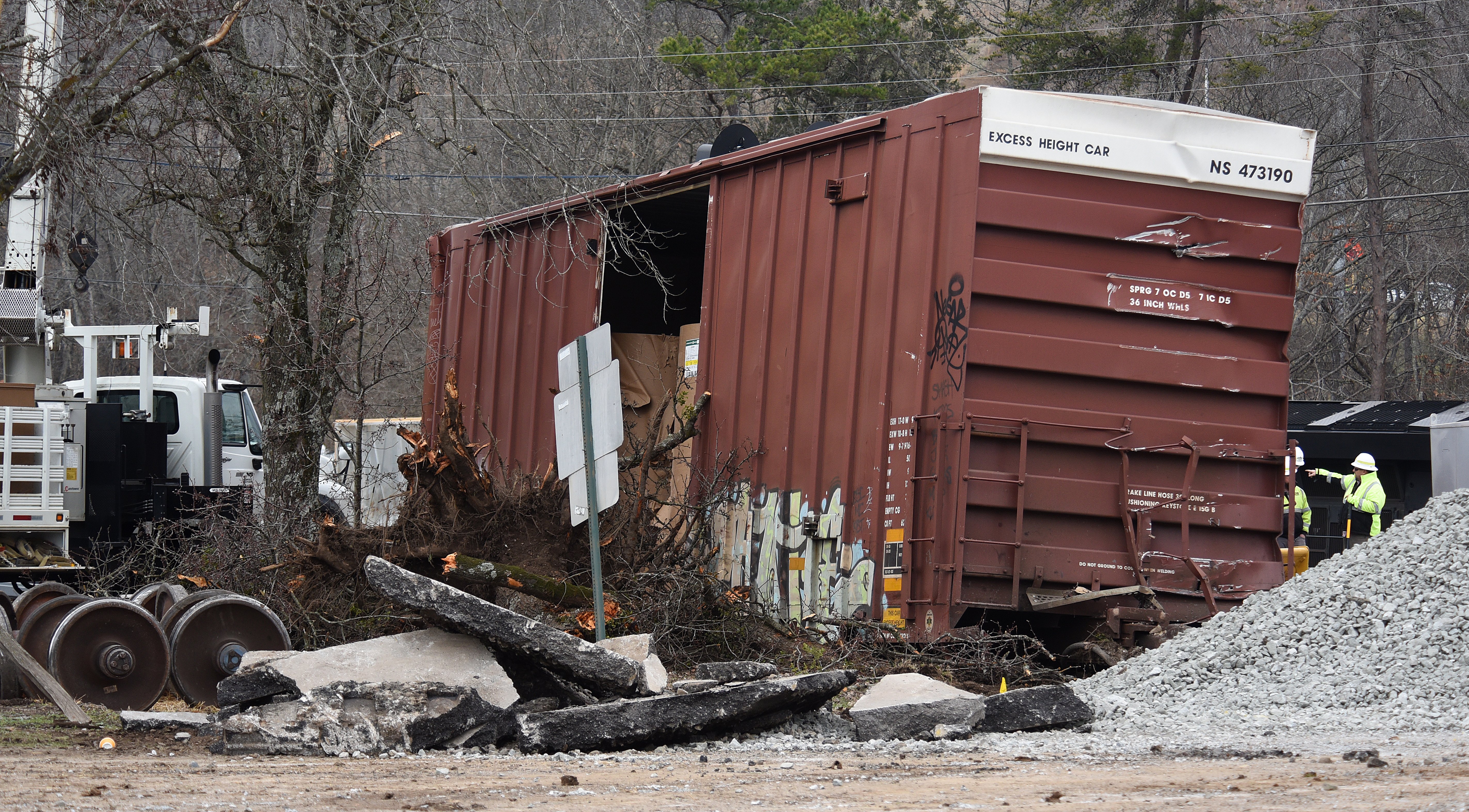 Staff photo by Matt Hamilton / A damaged train car sits at the site of the train derailment at the intersection of the tracks with Apison Pike on Wednesday, December 21, 2022.