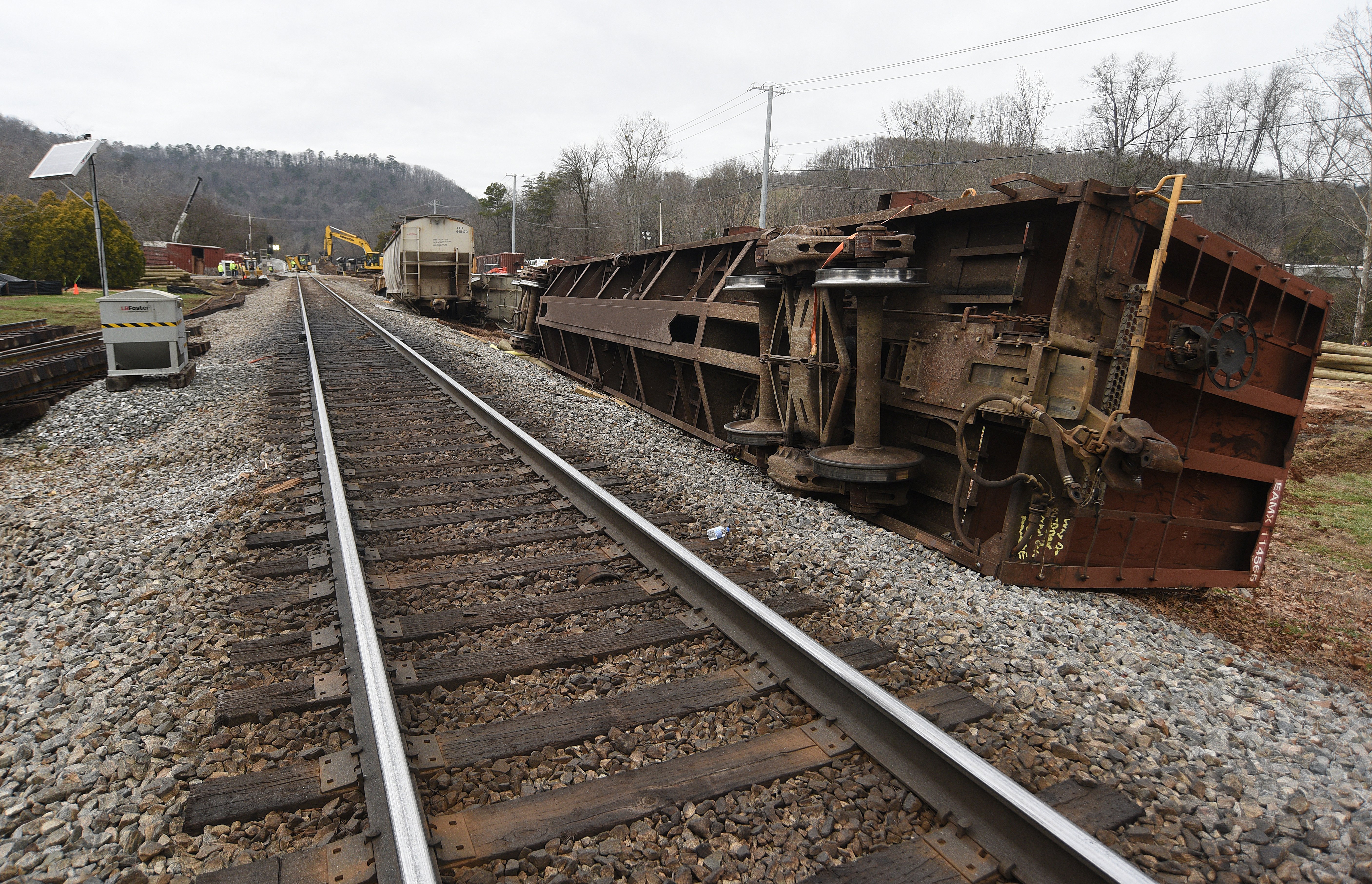 Staff photo by Matt Hamilton / Overturned train cars rest along the tracks at the site of the train derailment at the intersection of the tracks with Apison Pike on Wednesday, December 21, 2022.