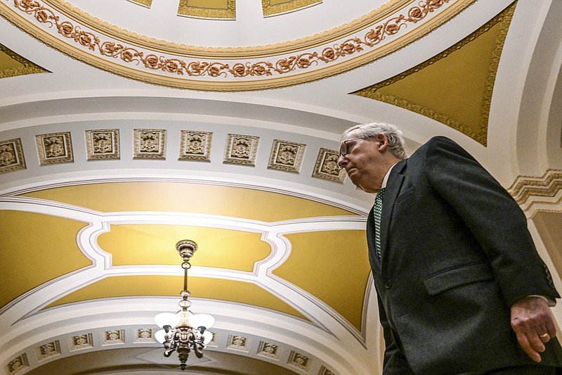 Senate Minority Leader Mitch McConnell walks outside the Senate Chamber on Wednesday. McConnell is facing pushback from many Republicans voicing resentment over having to vote so quickly on the budget bill.
(The New York Times/Kenny Holston)