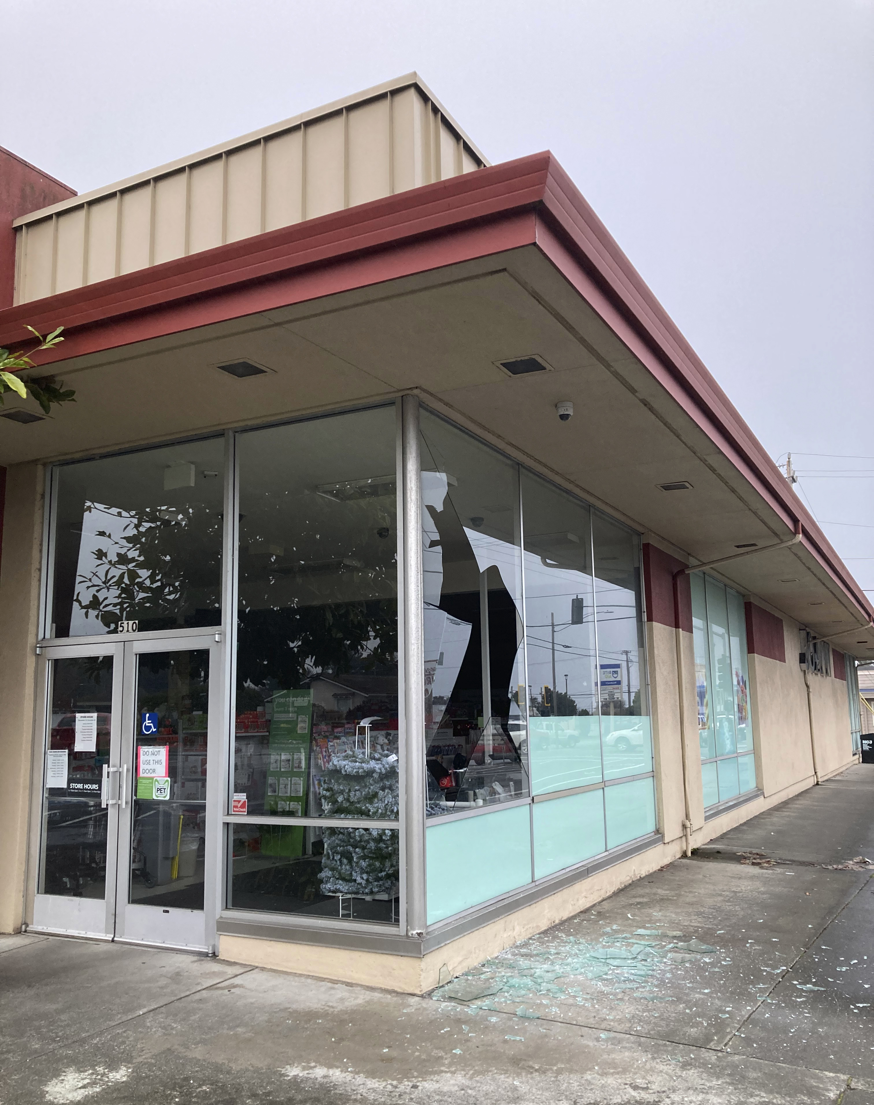 A shattered window is seen at JoAnn Fabrics following an earthquake in Eureka, Calif., Tuesday, Dec. 20, 2022. A strong earthquake shook a rural stretch of Northern California early Tuesday, jolting residents awake, cutting off power to 70,000 people, and damaging some buildings and a roadway, officials said. (Ruth Schneider/The Times-Standard via AP)