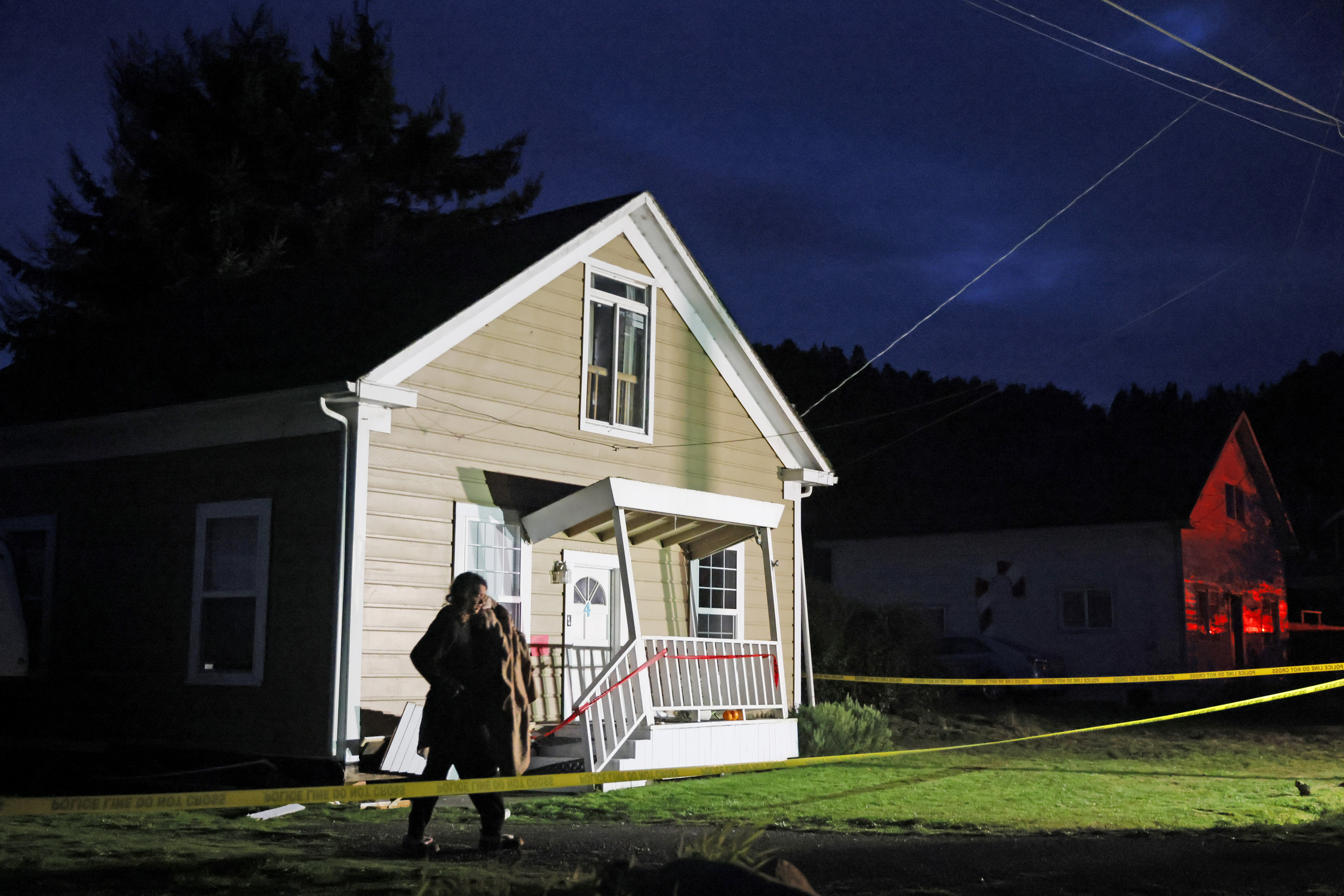 A person walks near a damaged home following an earthquake in Rio Dell, Calif., Tuesday, Dec. 20, 2022. (Santiago Mejia/San Francisco Chronicle via AP)