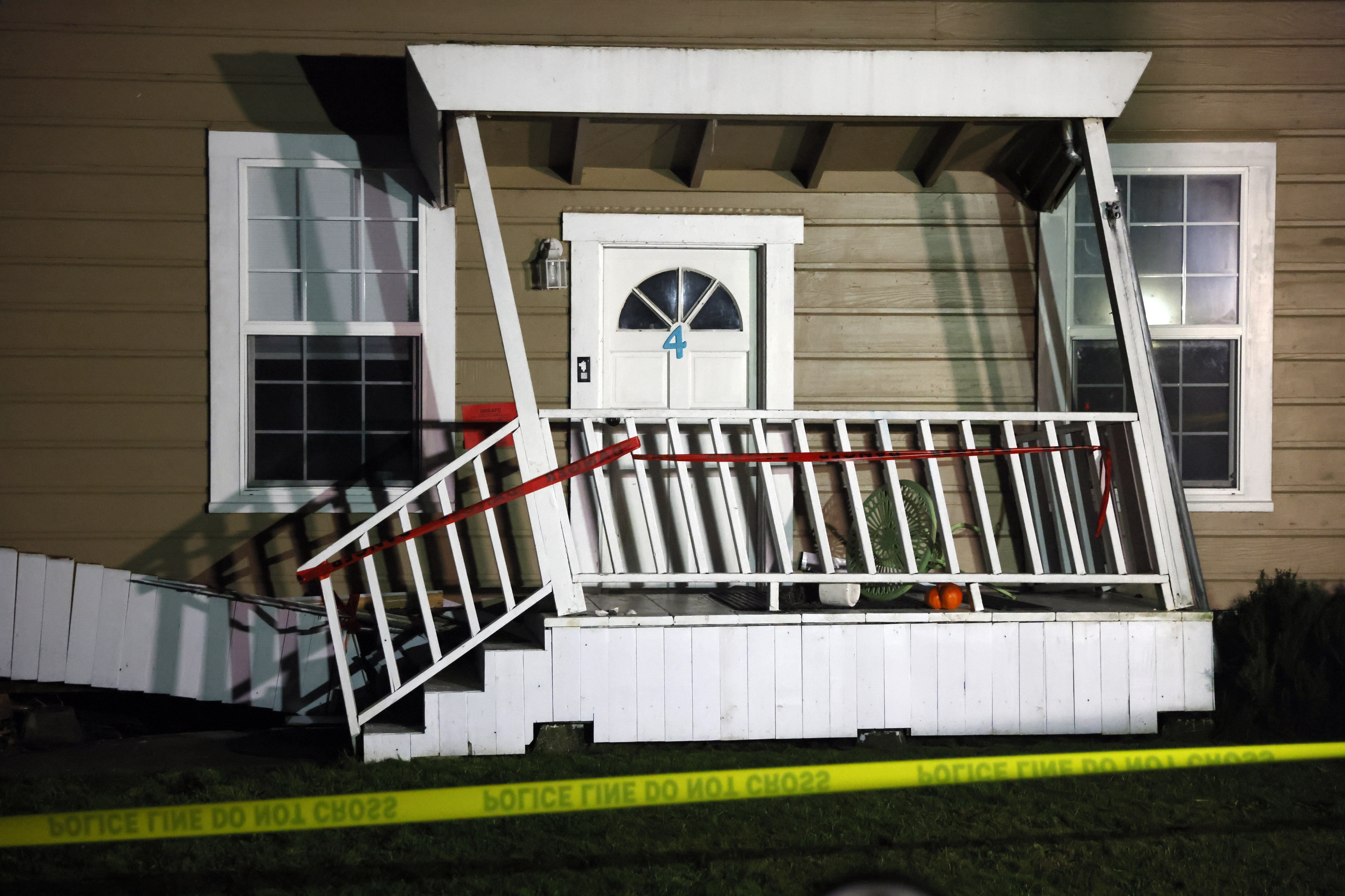 Caution tape is strung outside a damaged home following an earthquake in Rio Dell, Calif., Tuesday, Dec. 20, 2022. (Santiago Mejia/San Francisco Chronicle via AP)