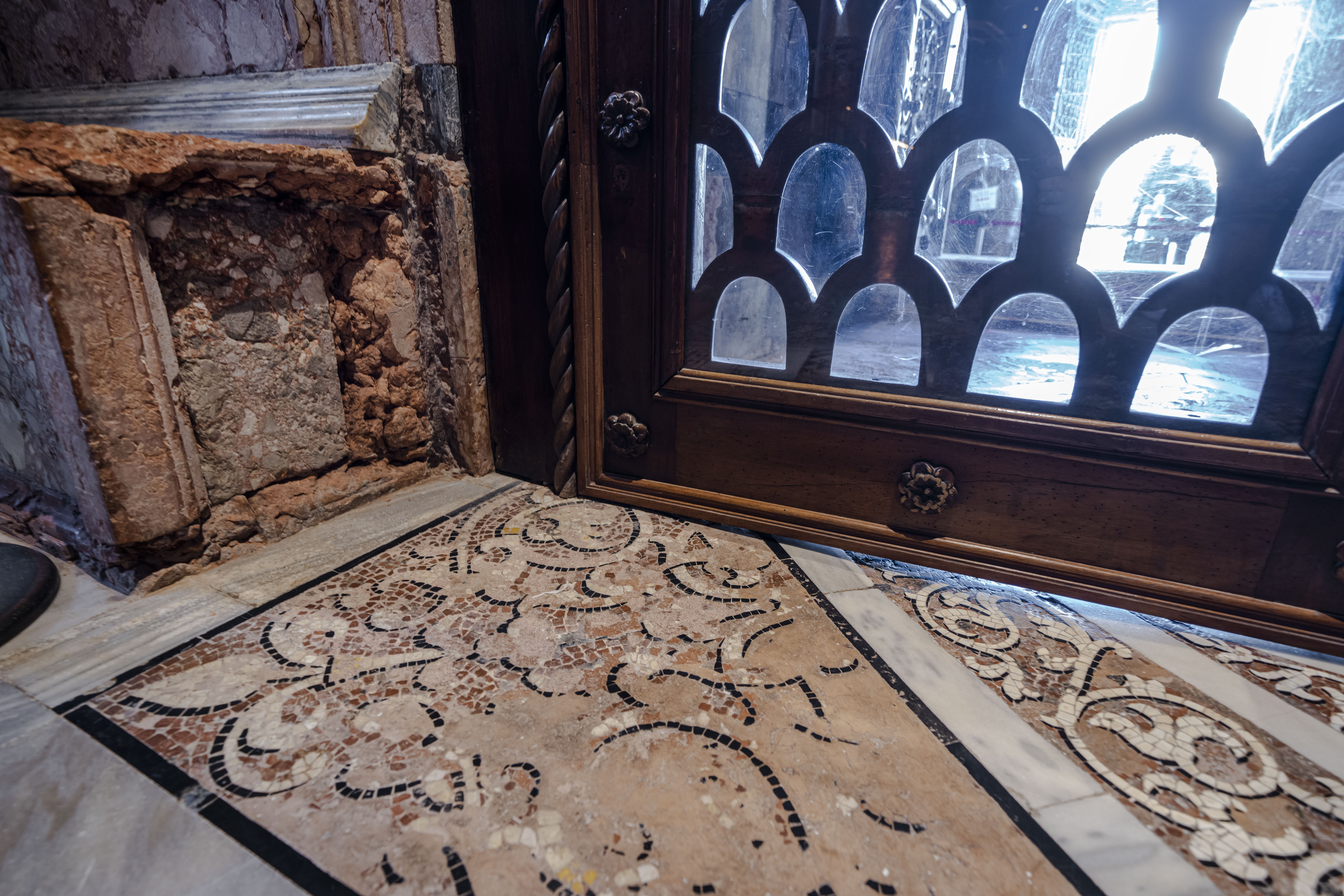 Signs of erosion are visible inside St. Mark's Basilica in Venice, northern Italy, Wednesday, Dec. 7, 2022. Glass barriers that prevent seawater from flooding the 900-year-old iconic Venice's Basilica during high tides have been recently installed in St. Mark's Square which is the lowest-laying city area and frequently ends up underwater during extreme weather. (AP Photo/Domenico Stinellis)