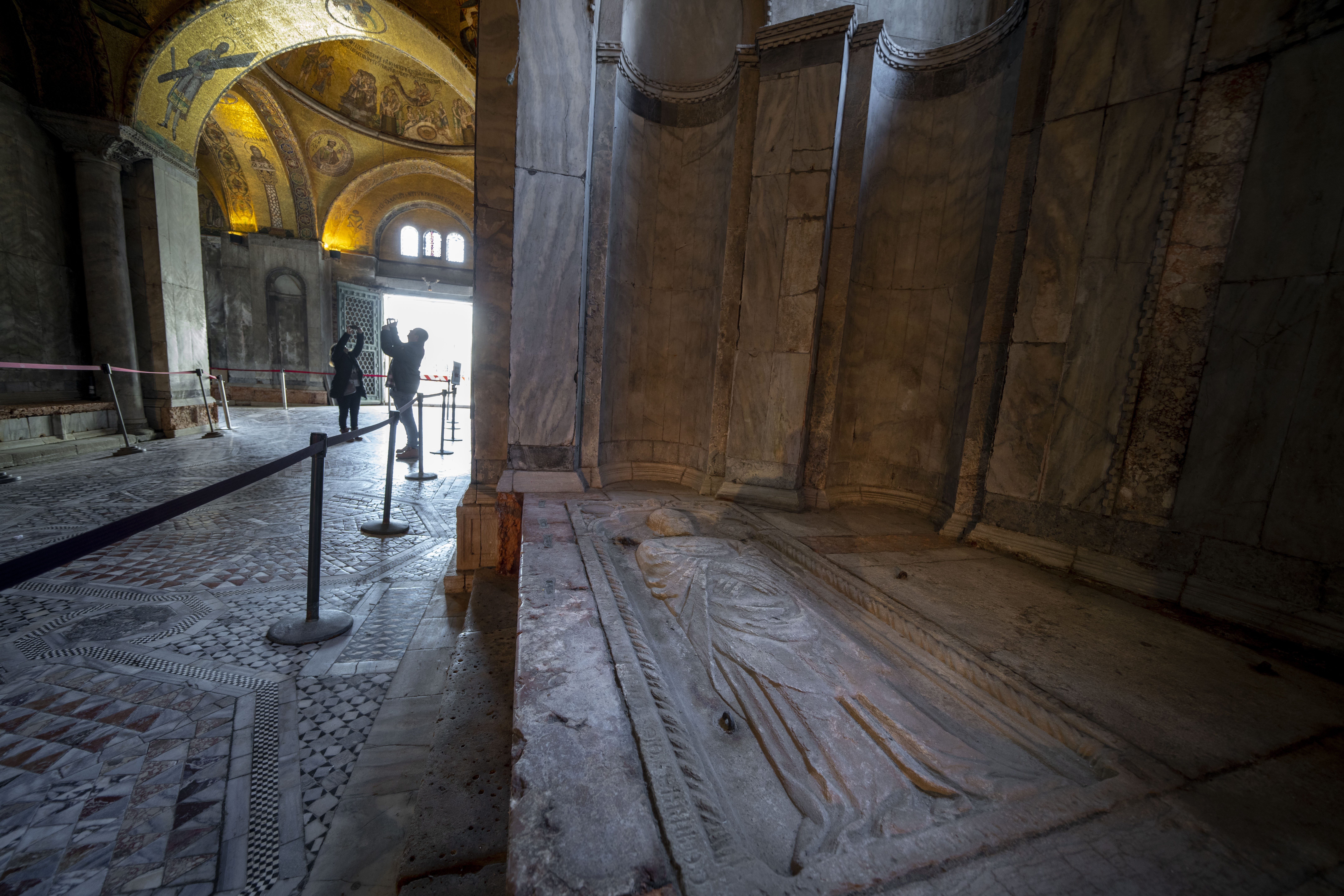 Signs of erosion are visible inside St. Mark's Basilica in Venice, northern Italy, Wednesday, Dec. 7, 2022. Glass barriers that prevent seawater from flooding the 900-year-old iconic Venice's Basilica during high tides have been recently installed in St. Mark's Square which is the lowest-laying city area and frequently ends up underwater during extreme weather. (AP Photo/Domenico Stinellis)