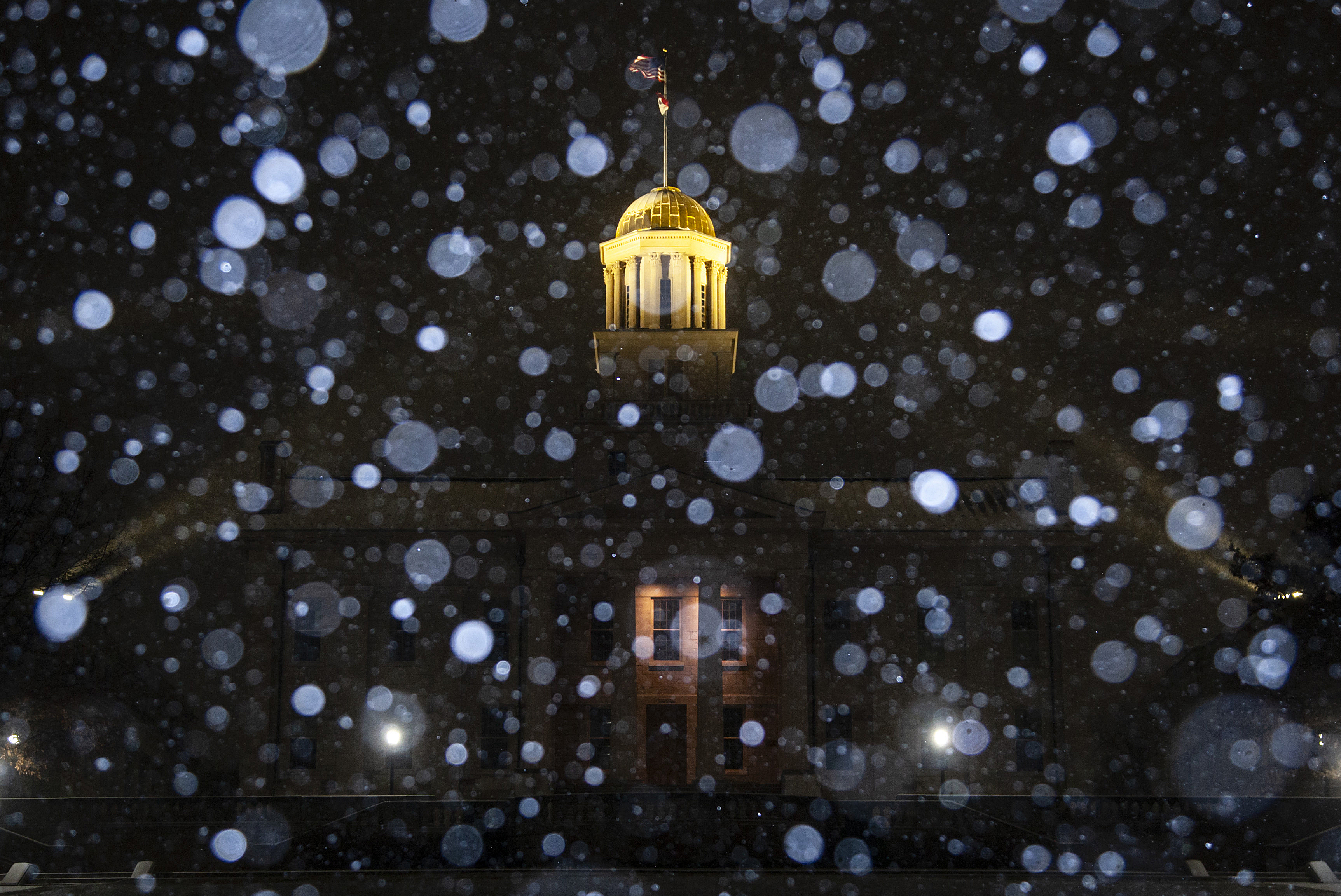 Snow falls during a blizzard warning, Wednesday, Dec. 21, 2022, at the Old Capitol Building in Iowa City, Iowa. (Joseph Cress/Iowa City Press-Citizen via AP)