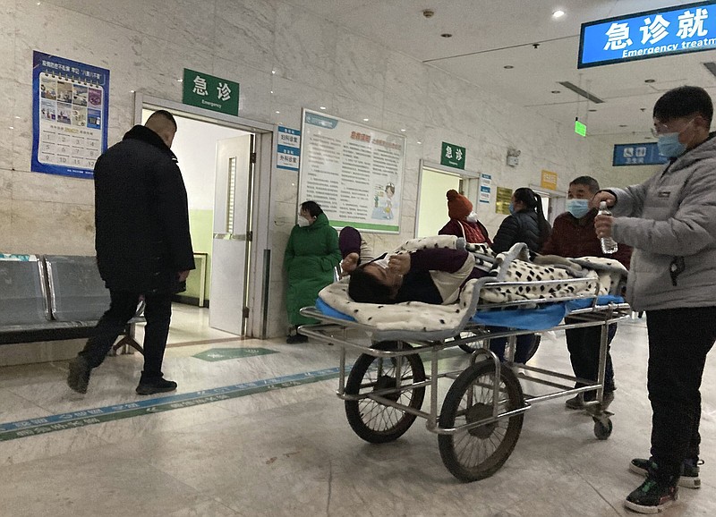 A patient is wheeled through the emergency room on Wednesday at the Zhuozhou Hospital in Zhuozhou city of the Baoding prefecture in northern China’s Hebei province.
(AP/Dake Kang)