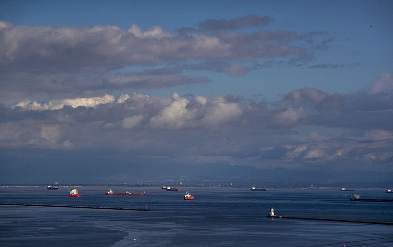 A handful of cargo ships are anchored on Dec. 12 outside the breakwater of the ports of Los Angeles and Long Beach, far fewer than the 109 ship backlog of cargo ships at the ports earlier in the year.
(TNS/Los Angeles Times/Brian van der Brug)
