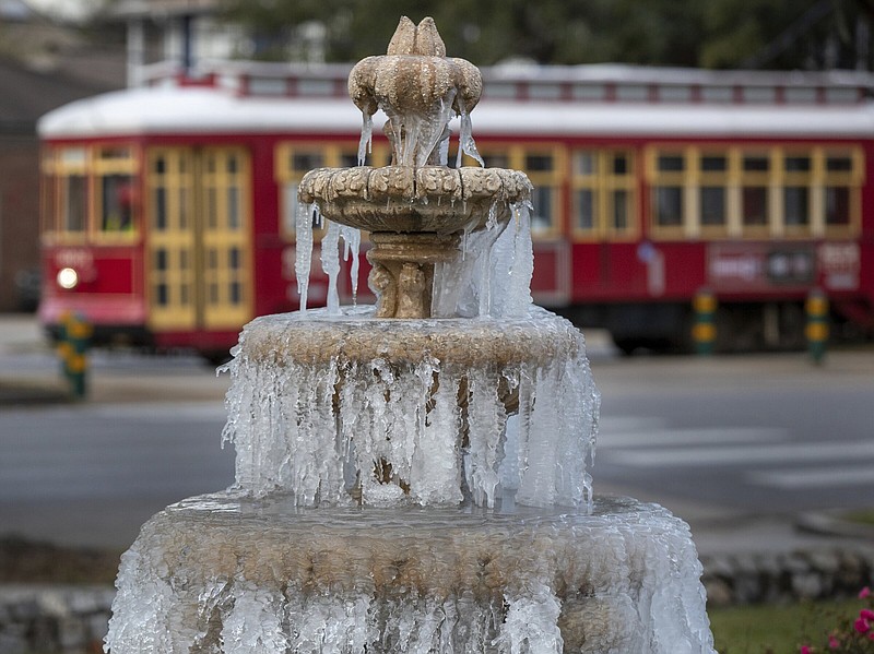 A fountain is frozen, as temperatures hovered in the mid-20s Saturday at Jacob Schoen & Son Funeral Home in New Orleans.
(AP/The Advocate/David Grunfeld)